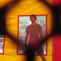 Student stands in a UGA themed bounce house