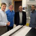 Four professors pose for the camera